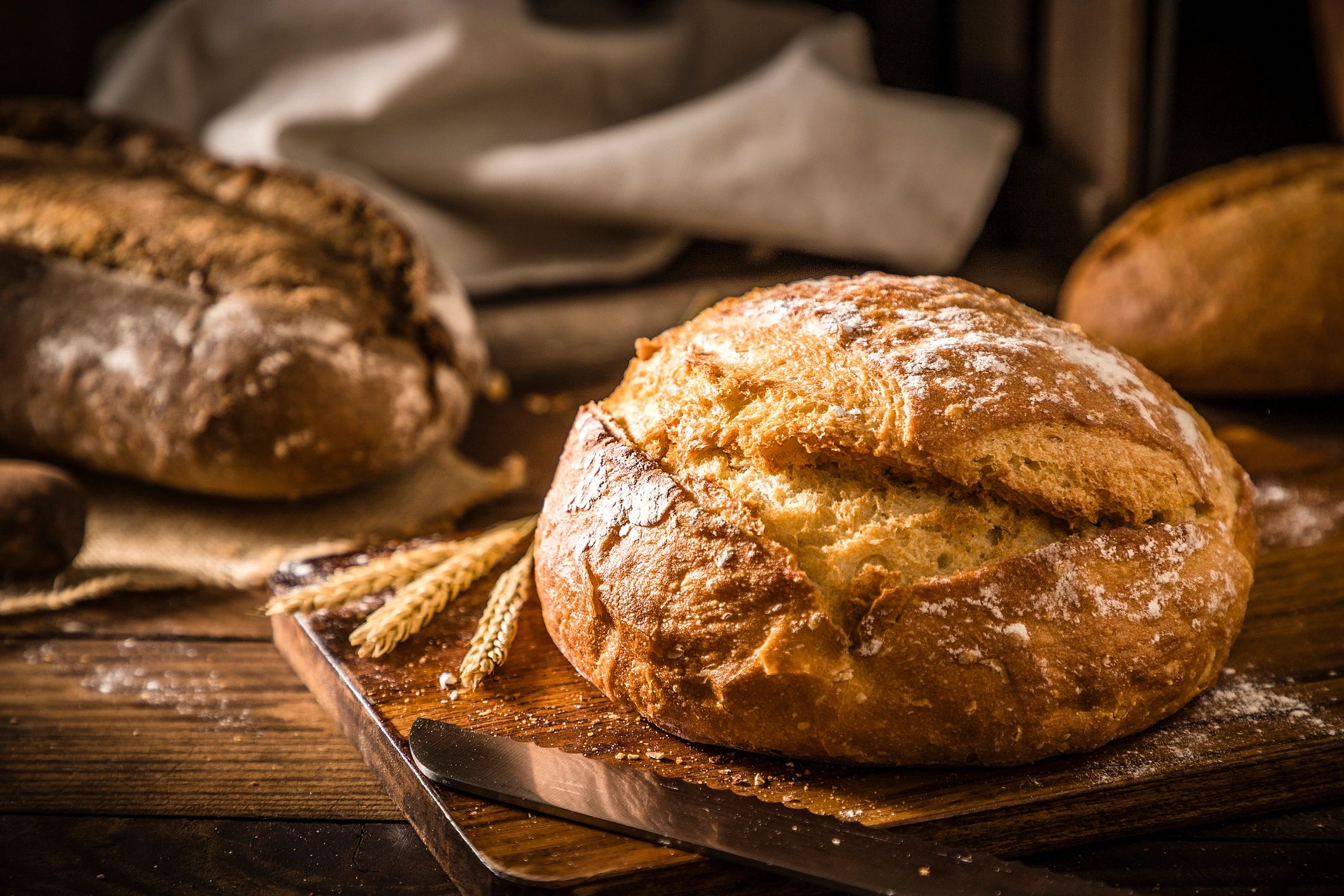 Loaf of bread on a rustic wooden table