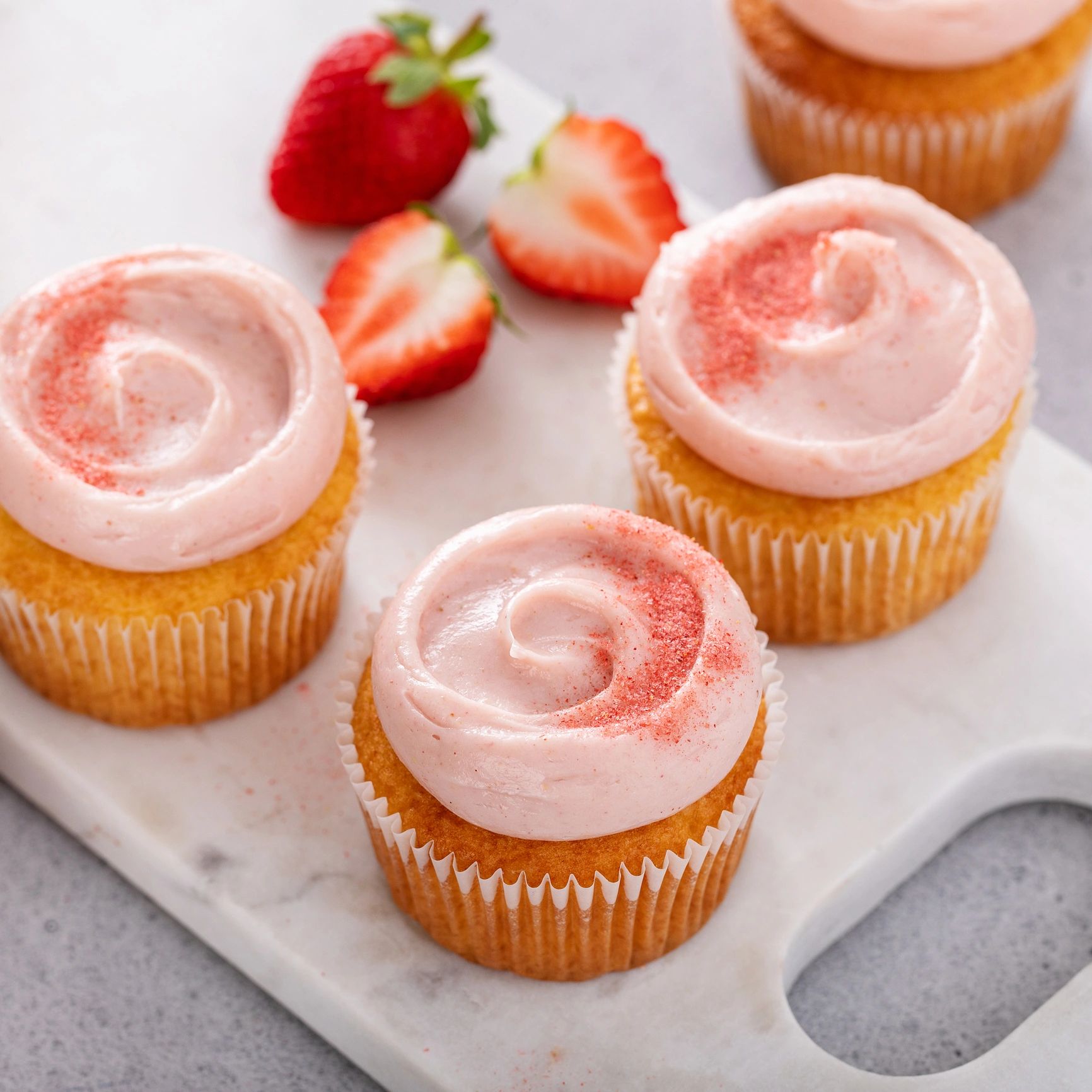 Assorted cupcakes with frosting