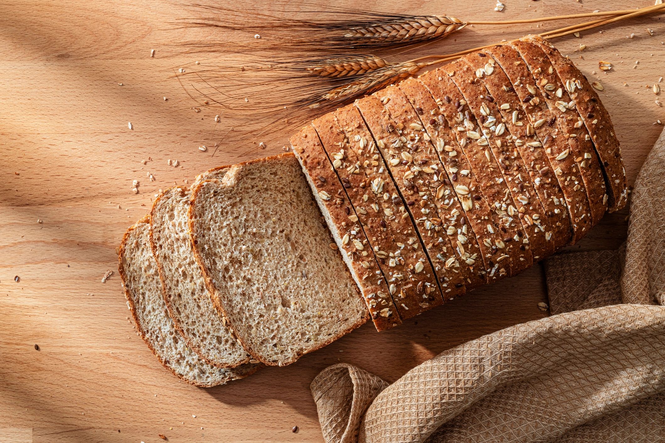 Wholegrain sliced bread on a wooden table