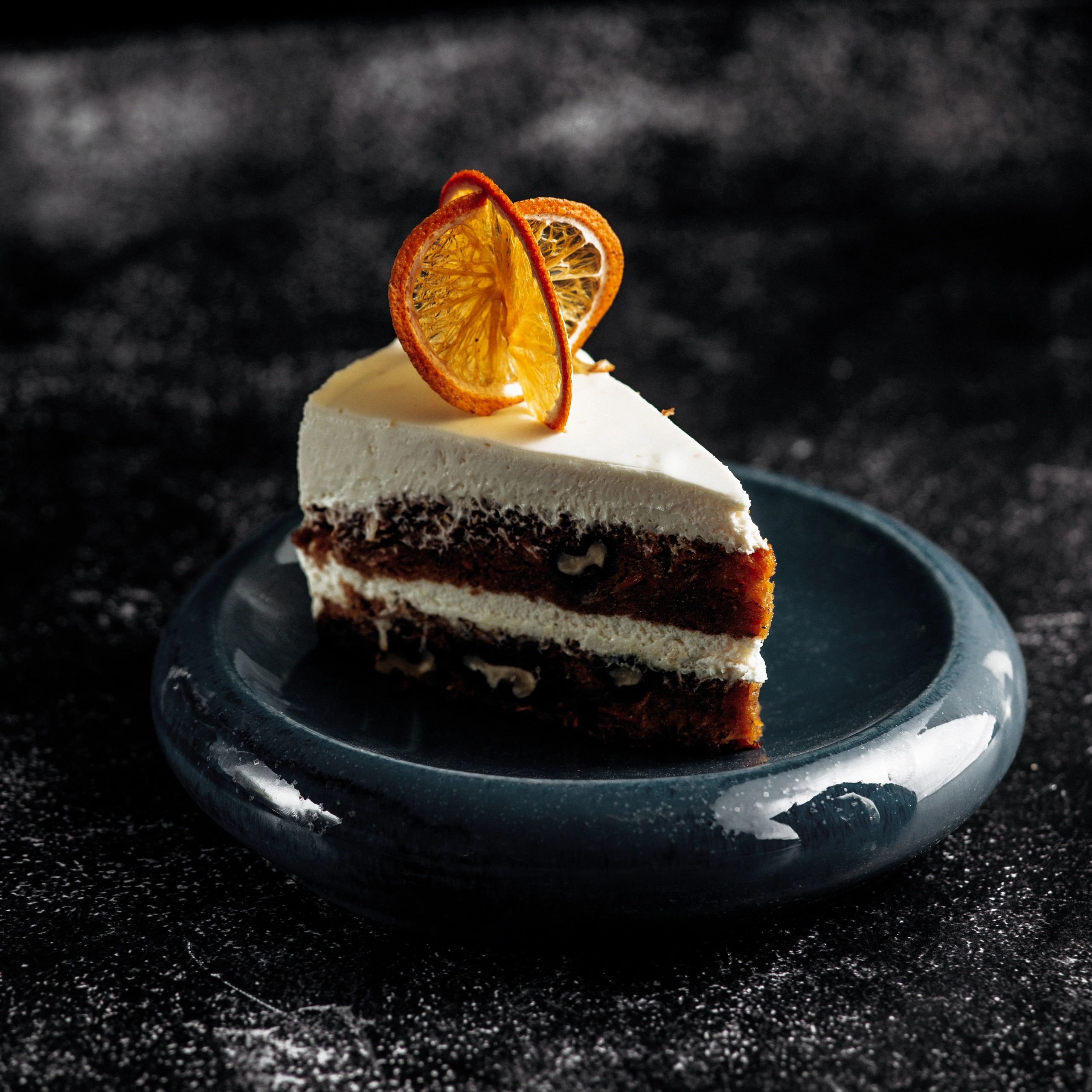 Slice of layered chocolate cake on a plate