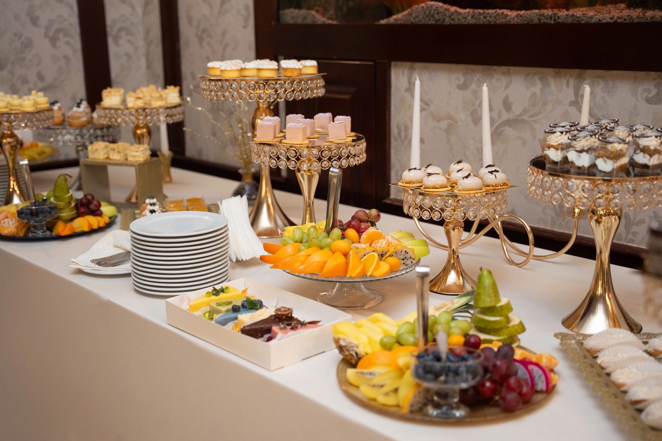 Dessert and pastry table with assorted mini cakes